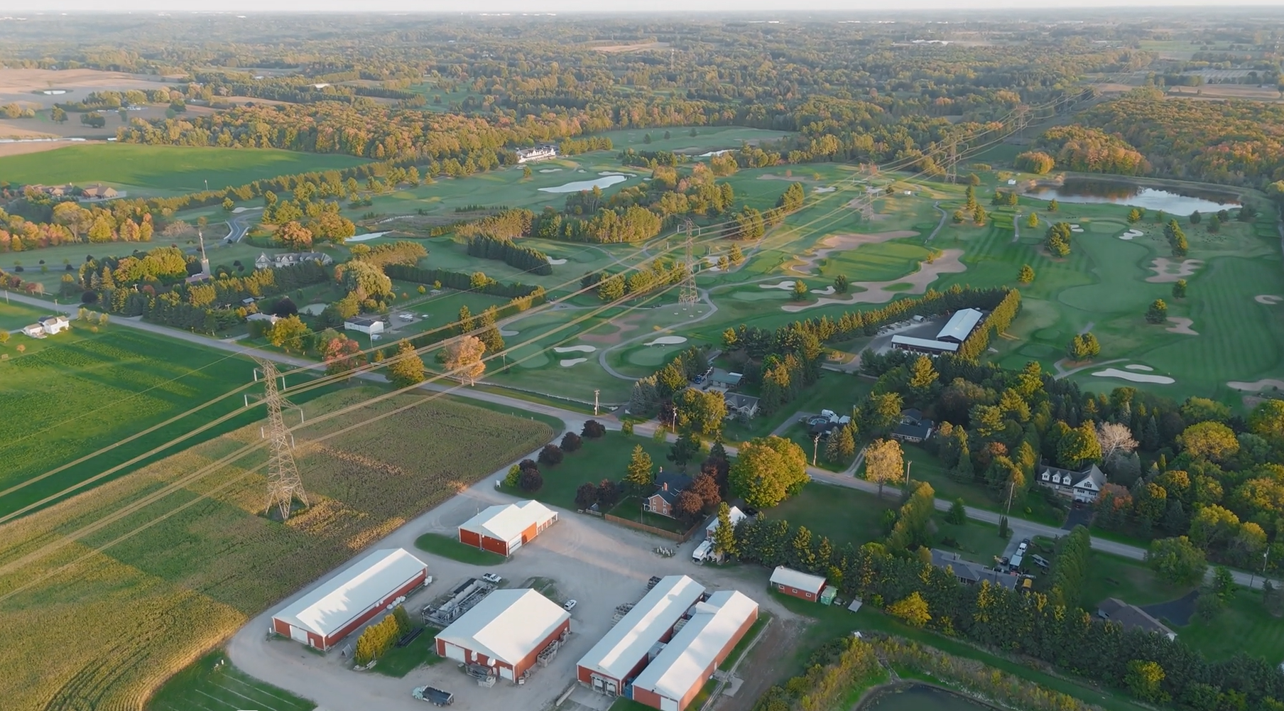 Aerial view of the family farm with Copetown Woods in the distance